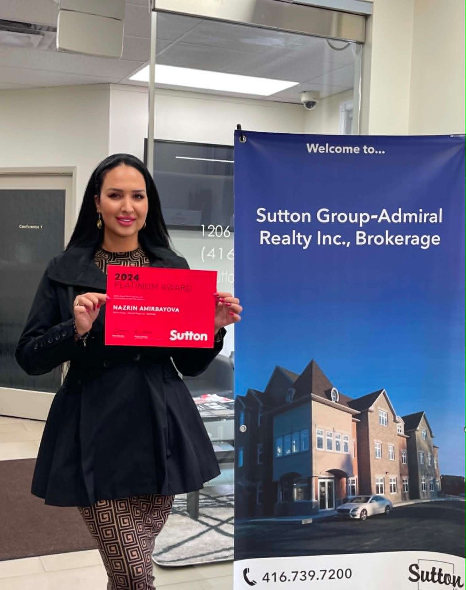 Nazrin Amirbayova holding the 2024 Sutton Platinum Award certificate